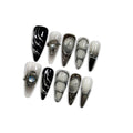 Hantyer Gothic Press on Nails with Tools Kit, 10pcs Long Stiletto Glossy Nails in Black & Metallic Silver, Hand-Painted 3D Art & Round Cat Eye Charms, Edgy Style for Concerts & Parties